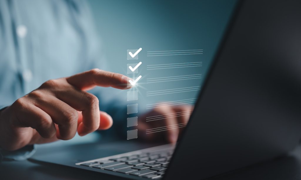 Professional completing evaluation checklist for behavioral health CRM assessment