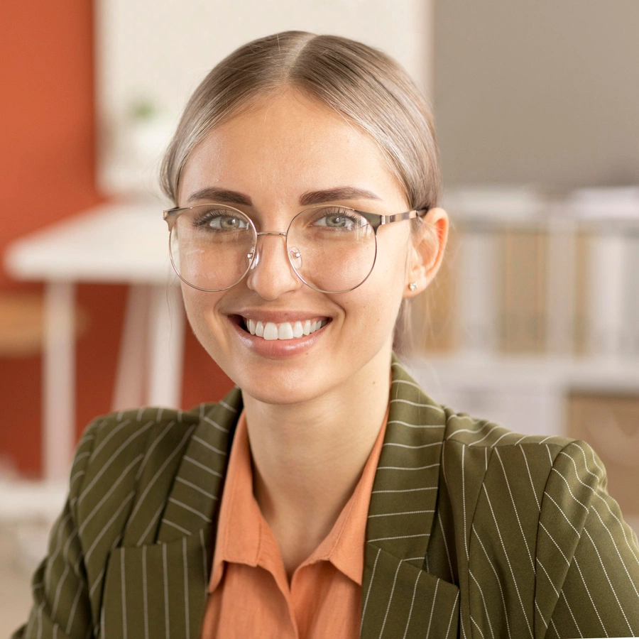 Female behavioral health professional smiling in business attire