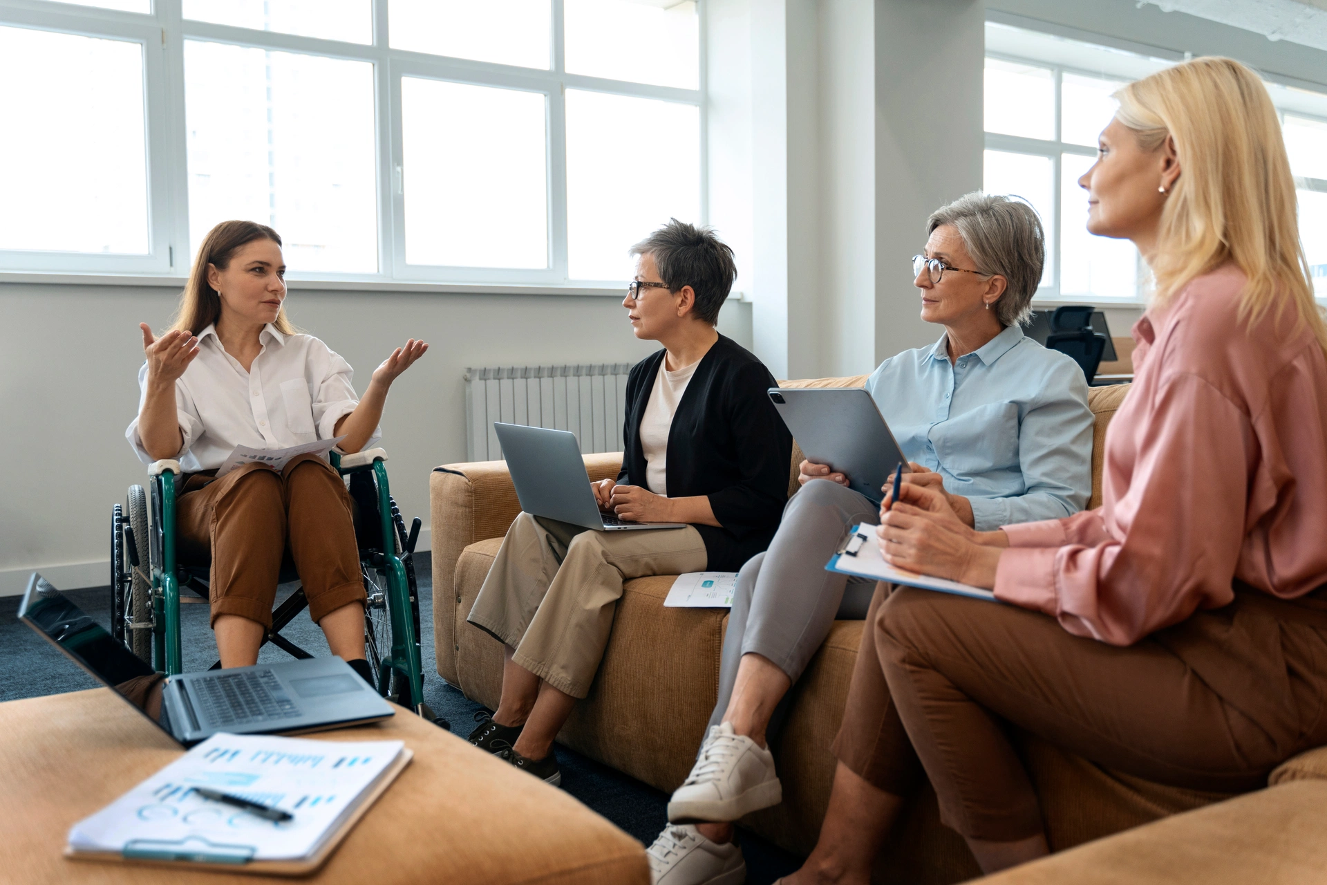 Group of behavioral health professionals in a meeting room discussion